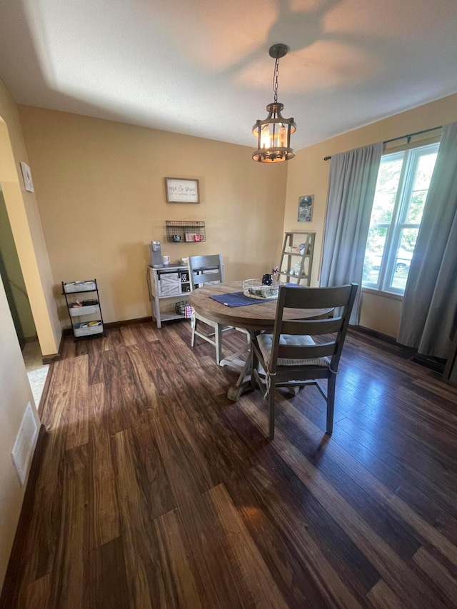 1889 Salt Lick Dr, Lancaster, OH 43130 - dining area with dark wood-type flooring and a chandelier