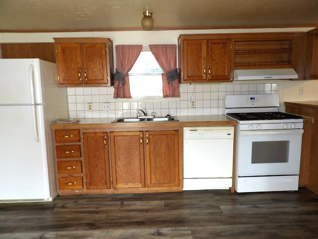 2445 Columbus Lancaster Rd NW Lot 463, Lancaster, OH 43130 - kitchen with white appliances, under cabinet range hood, brown cabinetry, and decorative backsplash