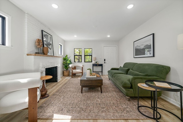 628 E Gates St, Columbus, OH 43206 - living area with wood finished floors, a fireplace, and recessed lighting