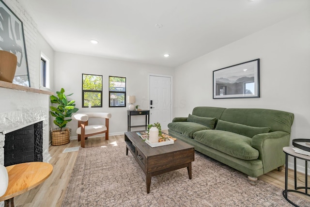 628 E Gates St, Columbus, OH 43206 - living room featuring wood finished floors, a fireplace, and recessed lighting