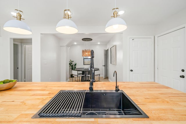 628 E Gates St, Columbus, OH 43206 - kitchen featuring wooden counters and hanging light fixtures