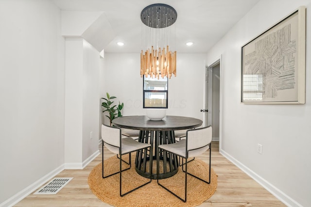 628 E Gates St, Columbus, OH 43206 - dining space featuring light wood-type flooring, a chandelier, and recessed lighting