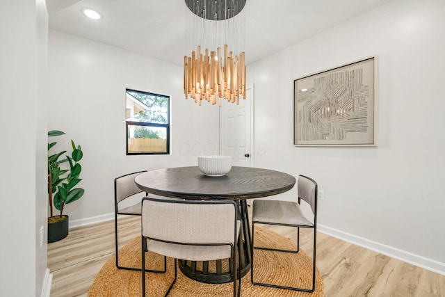 628 E Gates St, Columbus, OH 43206 - dining room with wood finished floors, a chandelier, and recessed lighting