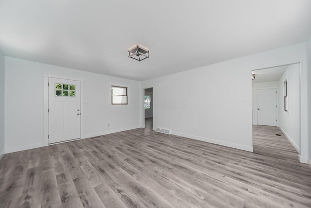 368 Woodview Dr, Chillicothe, OH 45601 - unfurnished living room with light wood-type flooring and baseboards