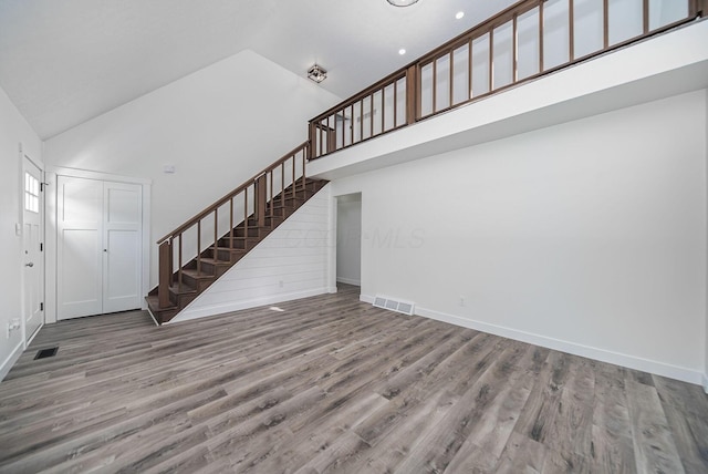 368 Woodview Dr, Chillicothe, OH 45601 - foyer entrance featuring high vaulted ceiling, stairs, and wood finished floors