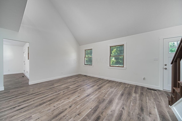 368 Woodview Dr, Chillicothe, OH 45601 - foyer entrance featuring stairs, wood finished floors, healthy amount of natural light, and high vaulted ceiling