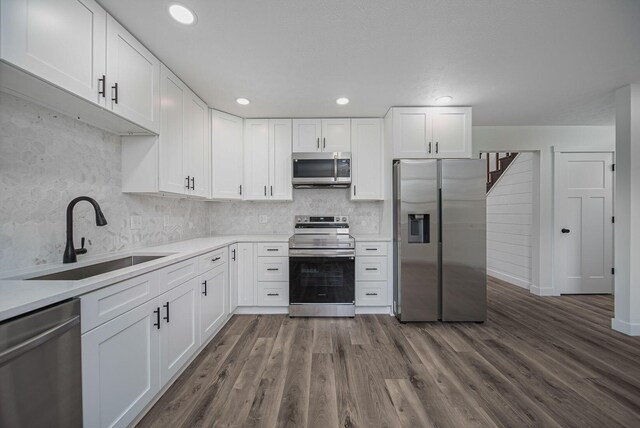 368 Woodview Dr, Chillicothe, OH 45601 - kitchen with stainless steel appliances, white cabinets, backsplash, light countertops, and recessed lighting