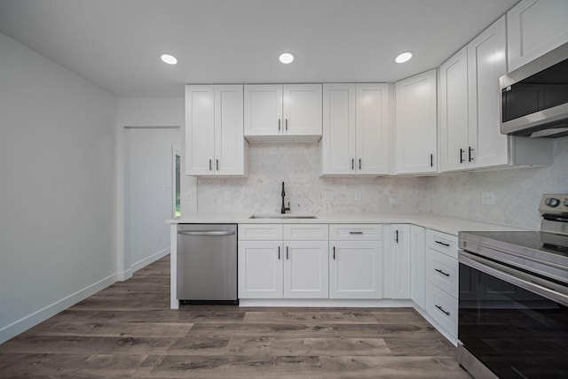 368 Woodview Dr, Chillicothe, OH 45601 - kitchen featuring stainless steel appliances, light countertops, white cabinetry, tasteful backsplash, and recessed lighting