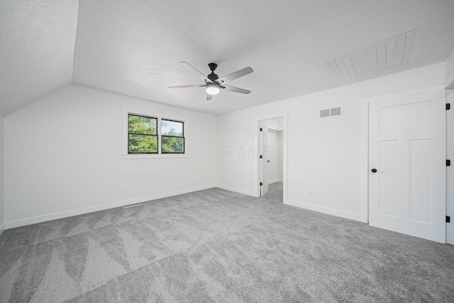 368 Woodview Dr, Chillicothe, OH 45601 - unfurnished bedroom with carpet floors, a textured ceiling, a ceiling fan, lofted ceiling, and a spacious closet