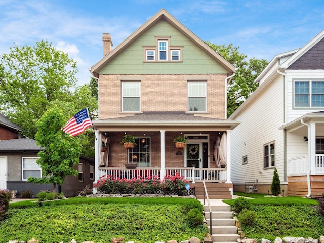 624 Oakwood Ave, Columbus, OH 43205 - view of front of home with brick siding, a porch, and a chimney