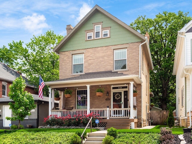 624 Oakwood Ave, Columbus, OH 43205 - view of front of property with brick siding, a porch, and a chimney