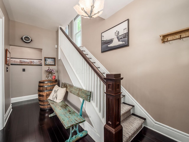 624 Oakwood Ave, Columbus, OH 43205 - stairway with hardwood / wood-style flooring and a chandelier