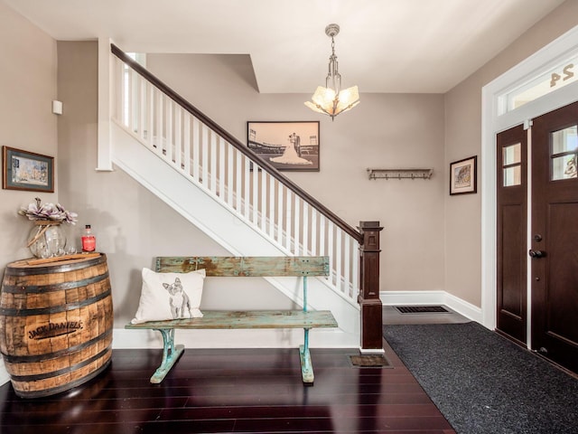 624 Oakwood Ave, Columbus, OH 43205 - entrance foyer featuring stairs, wood-type flooring, and a chandelier