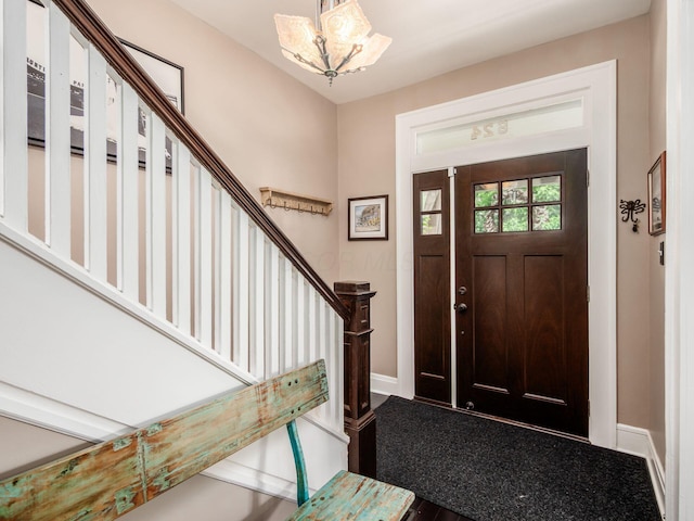 624 Oakwood Ave, Columbus, OH 43205 - entrance foyer with stairs and a chandelier