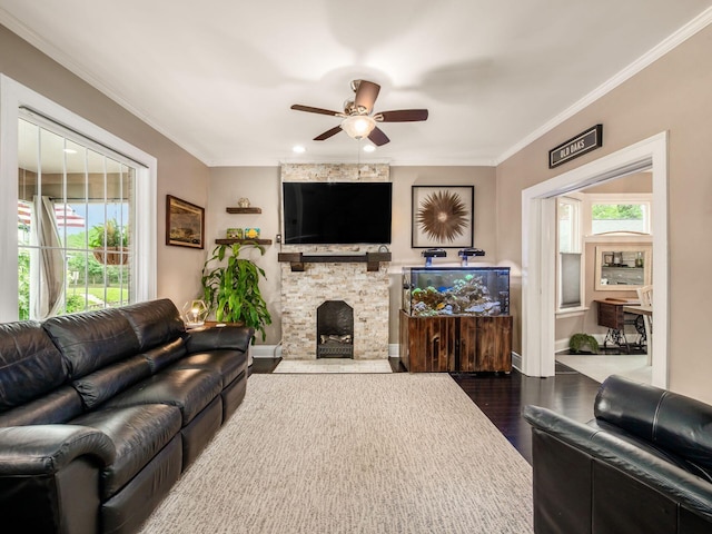 624 Oakwood Ave, Columbus, OH 43205 - living area with dark wood-type flooring, a ceiling fan, ornamental molding, and a fireplace