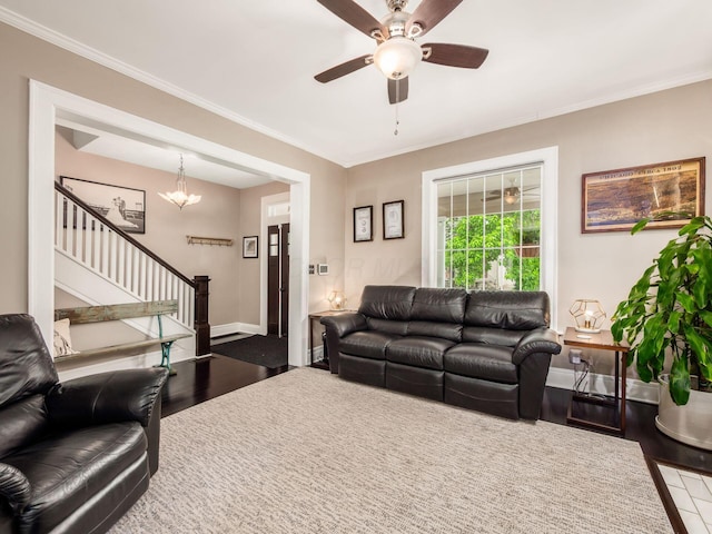 624 Oakwood Ave, Columbus, OH 43205 - living area with wood finished floors, stairway, ceiling fan, crown molding, and a chandelier