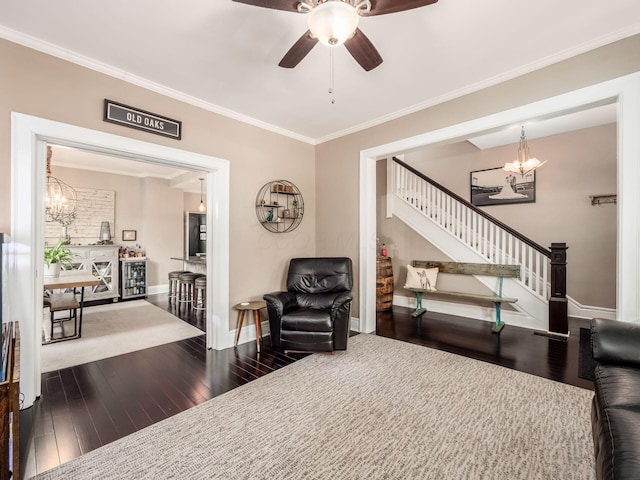 624 Oakwood Ave, Columbus, OH 43205 - sitting room with a chandelier, hardwood / wood-style flooring, stairs, ceiling fan, and crown molding