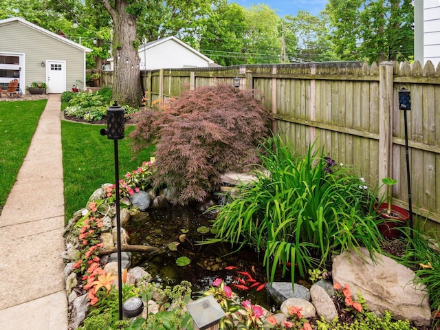 624 Oakwood Ave, Columbus, OH 43205 - fenced backyard with a small pond