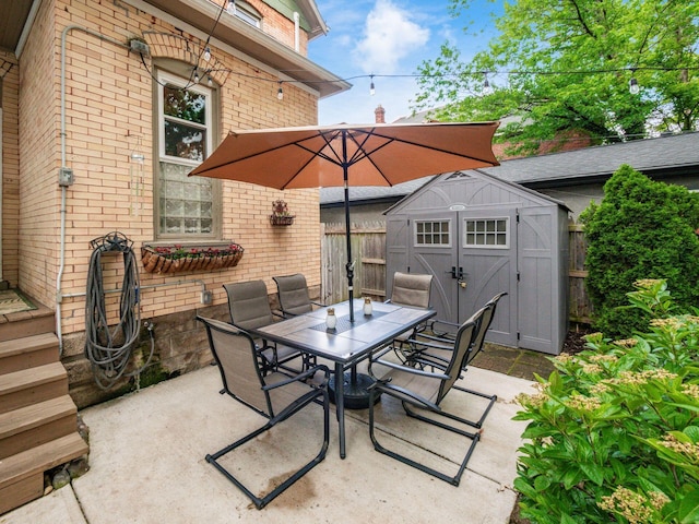 624 Oakwood Ave, Columbus, OH 43205 - view of patio featuring outdoor dining space and a storage shed