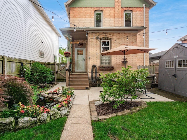 624 Oakwood Ave, Columbus, OH 43205 - view of front of home featuring a shed, brick siding, and a patio area