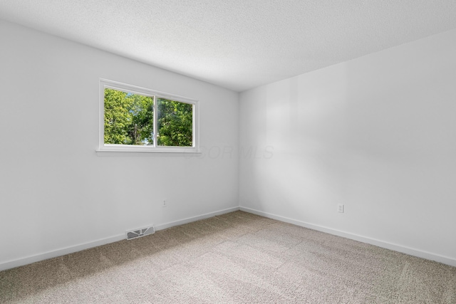 3048 Wallingford Ave, Columbus, OH 43231 - carpeted spare room featuring a textured ceiling and baseboards