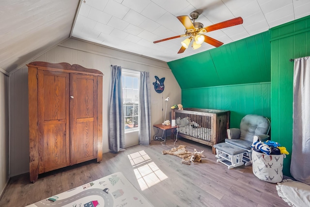 405 N Main St, Nevada, OH 44849 - sitting room with lofted ceiling, wood finished floors, a ceiling fan, and wooden walls