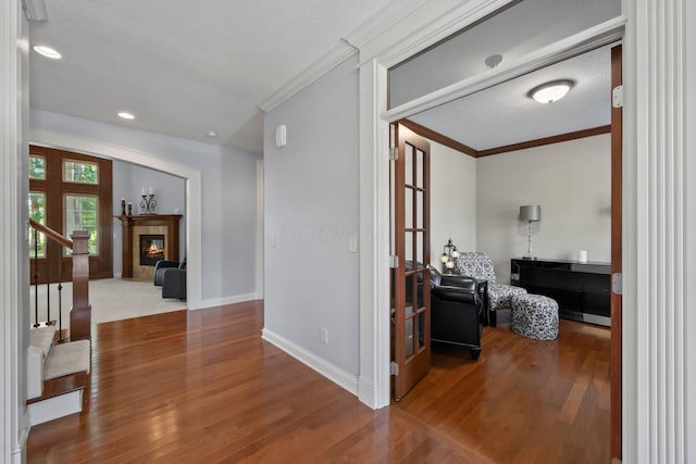 6820 Mahogany Dr, Galena, OH 43021 - hallway featuring crown molding, wood finished floors, a textured ceiling, recessed lighting, and stairway