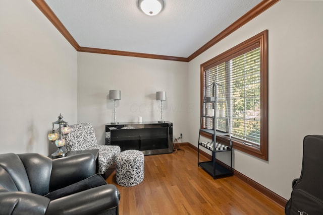 6820 Mahogany Dr, Galena, OH 43021 - living area featuring wood finished floors and crown molding