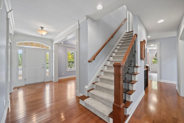 6820 Mahogany Dr, Galena, OH 43021 - foyer featuring wood finished floors, stairs, recessed lighting, and ornamental molding