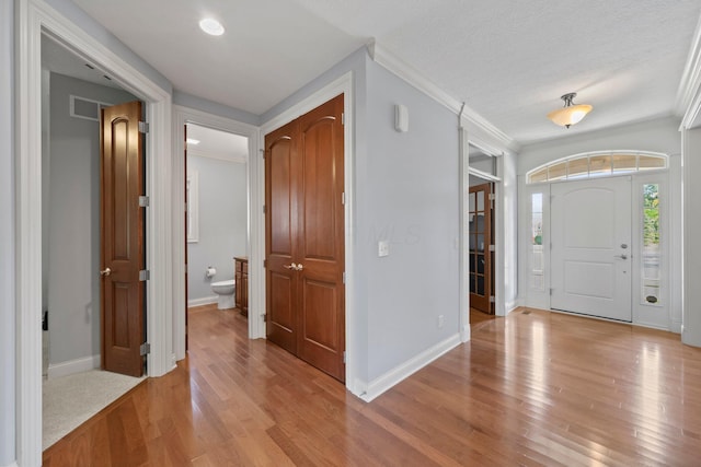 6820 Mahogany Dr, Galena, OH 43021 - foyer with crown molding and light wood-style flooring
