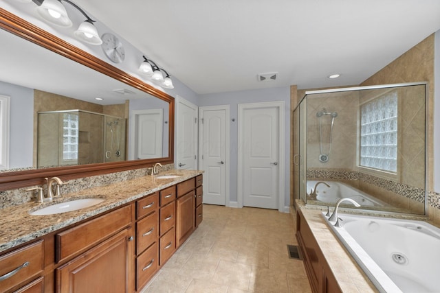 6820 Mahogany Dr, Galena, OH 43021 - full bathroom featuring a stall shower, a whirlpool tub, double vanity, and tile patterned flooring