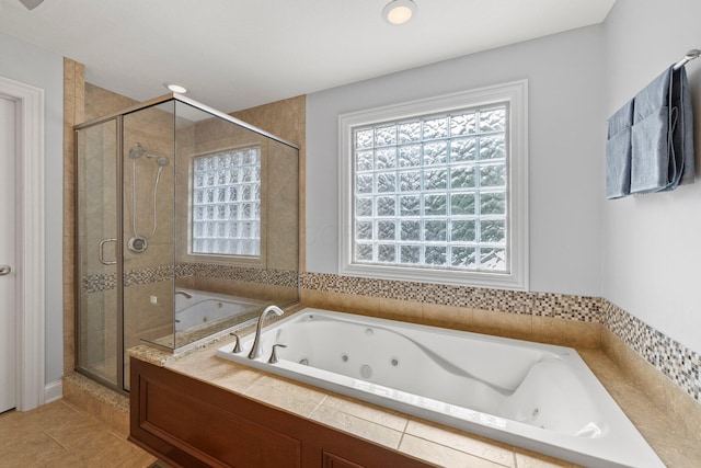 6820 Mahogany Dr, Galena, OH 43021 - full bathroom featuring plenty of natural light, a stall shower, a whirlpool tub, and tile patterned floors
