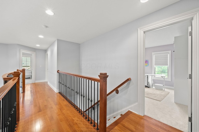 6820 Mahogany Dr, Galena, OH 43021 - hall featuring an upstairs landing, wood finished floors, healthy amount of natural light, and recessed lighting