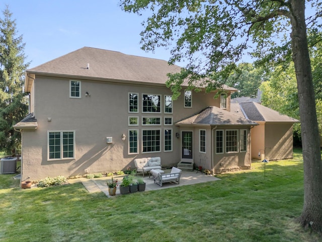 6820 Mahogany Dr, Galena, OH 43021 - back of house featuring stucco siding, an outdoor living space, a patio, a lawn, and entry steps