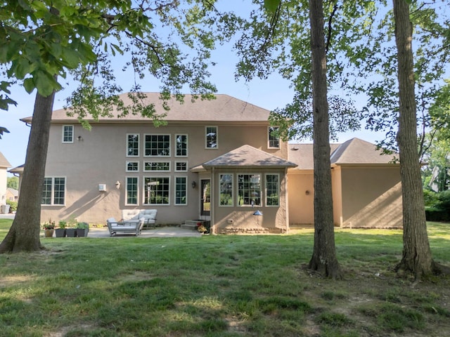 6820 Mahogany Dr, Galena, OH 43021 - back of property with stucco siding, a patio, and a lawn