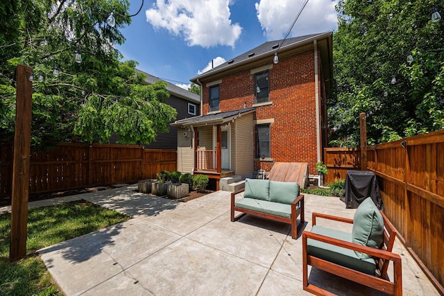 199 E Gates St, Columbus, OH 43206 - fenced backyard featuring a patio, grilling area, and an outdoor living space