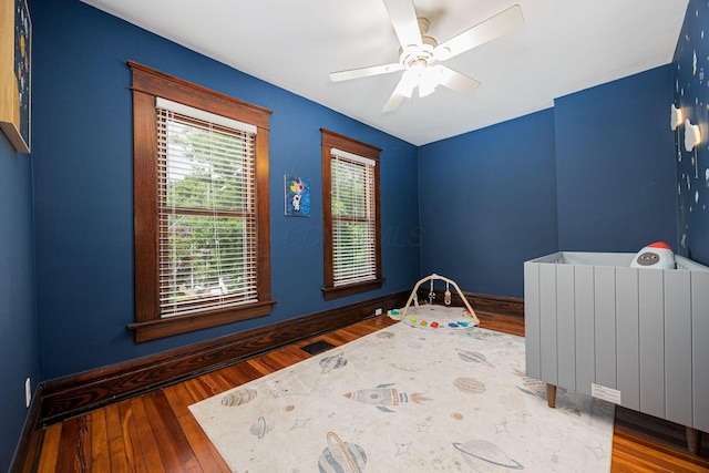 199 E Gates St, Columbus, OH 43206 - unfurnished bedroom featuring wood finished floors and ceiling fan