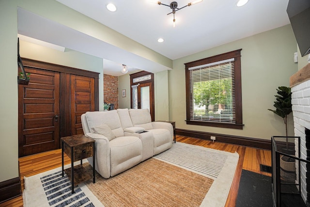 199 E Gates St, Columbus, OH 43206 - living room with a fireplace, wood finished floors, and recessed lighting