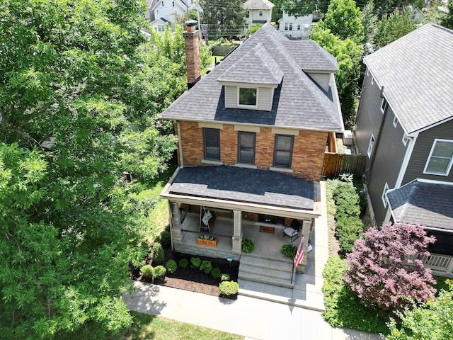 199 E Gates St, Columbus, OH 43206 - view of front of property with a chimney, roof with shingles, brick siding, and a porch