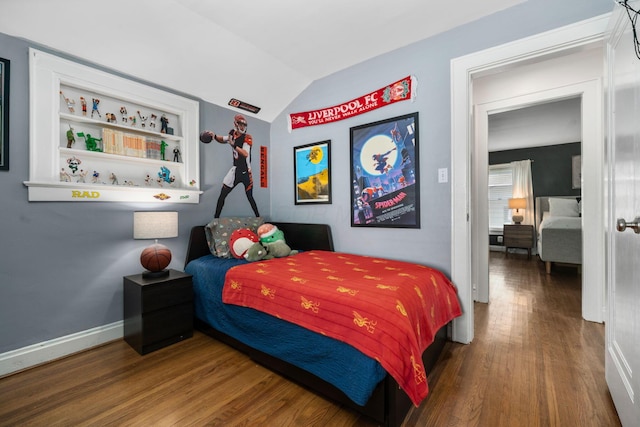 70 N Cassingham Rd, Columbus, OH 43209 - bedroom with wood finished floors and vaulted ceiling