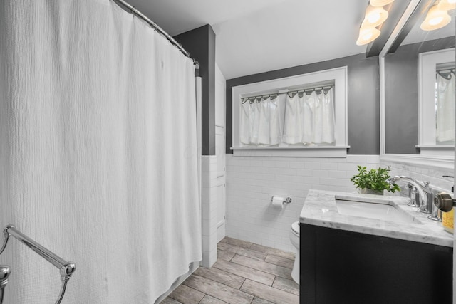 70 N Cassingham Rd, Columbus, OH 43209 - bathroom featuring tile walls, vanity, wainscoting, and a shower with shower curtain