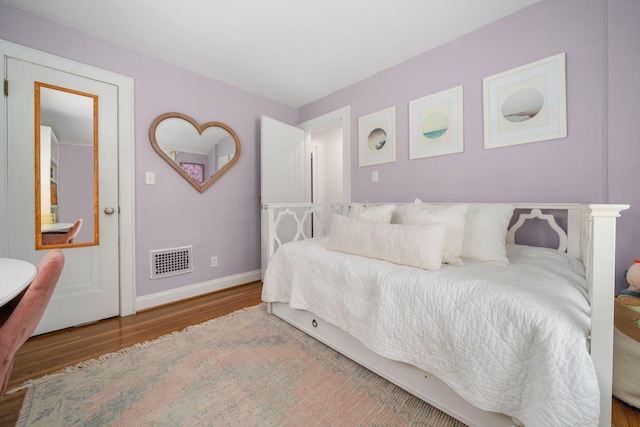 70 N Cassingham Rd, Columbus, OH 43209 - bedroom with wood finished floors and baseboards