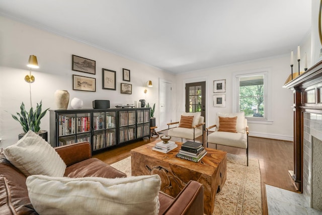 70 N Cassingham Rd, Columbus, OH 43209 - living area featuring a high end fireplace, wood finished floors, and crown molding