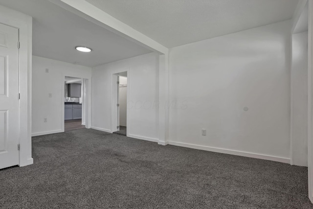 8898 Baker Rd, Stoutsville, OH 43154 - spare room with dark carpet and baseboards