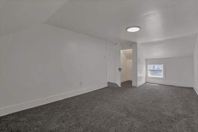 8898 Baker Rd, Stoutsville, OH 43154 - bonus room with vaulted ceiling and dark carpet