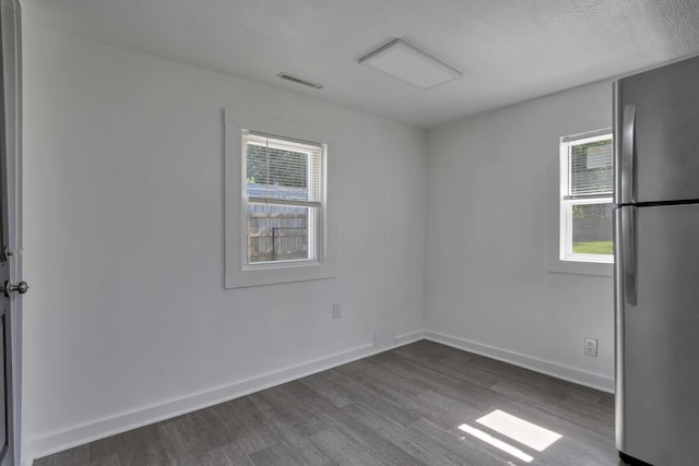 8898 Baker Rd, Stoutsville, OH 43154 - spare room featuring dark wood finished floors and a textured ceiling