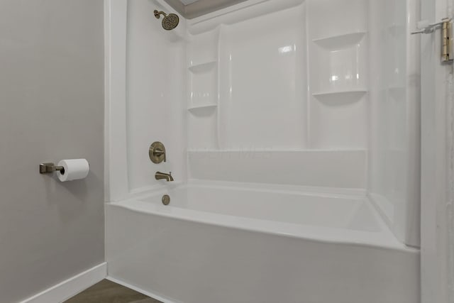 8898 Baker Rd, Stoutsville, OH 43154 - bathroom with shower / bathtub combination and wood finished floors