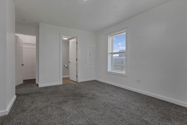 8898 Baker Rd, Stoutsville, OH 43154 - unfurnished bedroom with carpet floors and baseboards