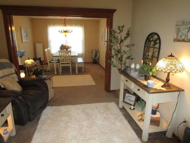 5669 Maplewood Ct, Lewis Center, OH 43035 - carpeted living area featuring a chandelier