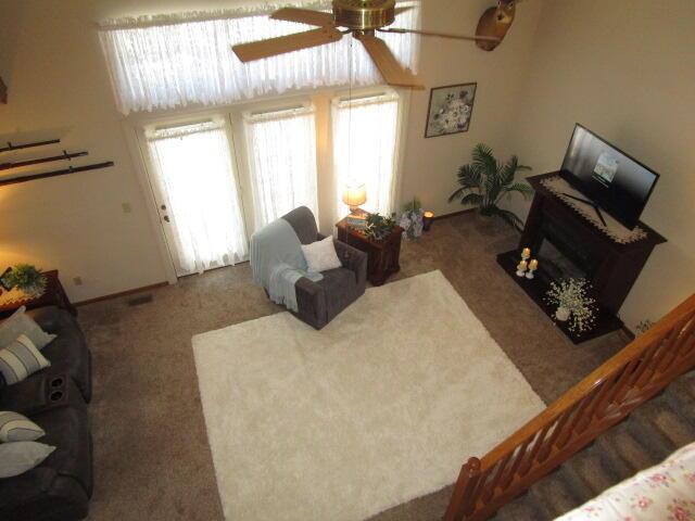 5669 Maplewood Ct, Lewis Center, OH 43035 - carpeted living room featuring a ceiling fan
